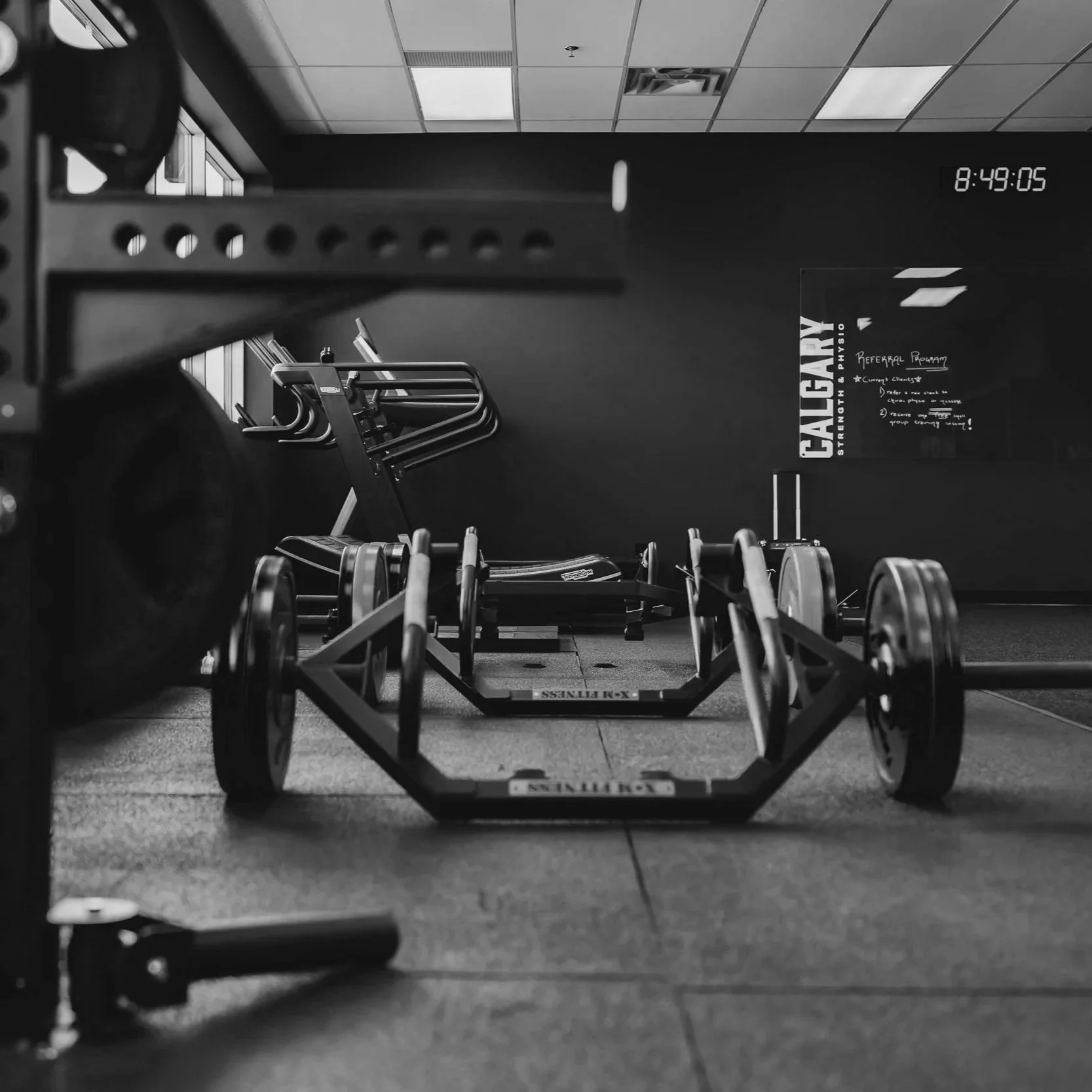 Sled and specialty bars on the training floor